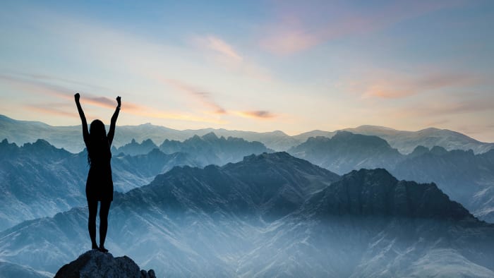 Standing on a mountain top