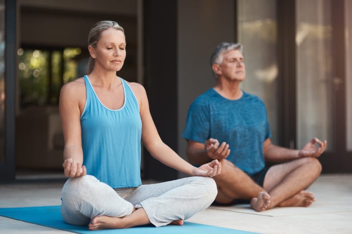 A couple meditating together