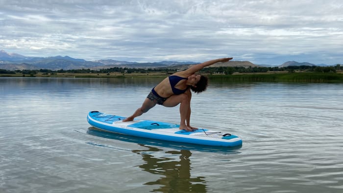 Author Elizabeth Marglin practicing yoga on the Bic Sport 10’6 Beach Air SUP